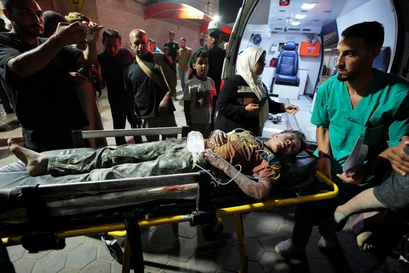 A Palestinian wounded in an Israeli bombardment on the Gaza Strip is brought to Al Aqsa hospital in Deir al Balah, central Gaza Strip, on Sunday, May 26, 2024. (AP Photo/Abdel Kareem Hana)