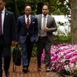 New York City Mayor Eric Adams, second right, exits Gracie Mansion, the official residence of the mayor, Thursday, Sept. 26, 2024, in New York. (AP Photo/Yuki Iwamura)