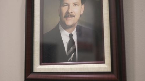 A portrait of board member Daniel D. Seckinger was added to the wall of past board members on Thursday, Dec. 20, 2018. At the same board meeting it was announced that the newest high school on the project list — on in the Mill Creek cluster will be named for Seckinger. (Casey Sykes for The Atlanta Journal-Constitution)