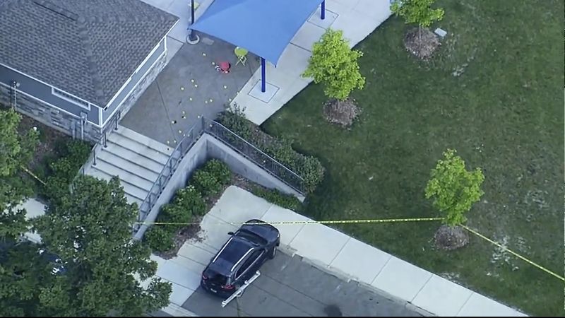 Police respond to the scene of a shooting at the Brooklands Plaza Splash Pad, Saturday, June 15, 2024, in Rochester Hills, Mich. The Oakland County Sheriff’s Office says there are “numerous wounded victims” after police were called for an active shooter. (WXYZ via AP)