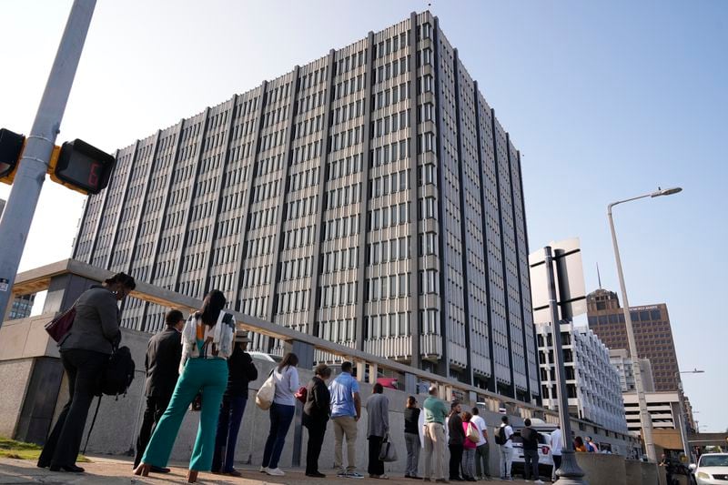 People wait to enter the federal courthouse before the start of jury selection of the trial in the Tyre Nichols case Monday, Sept. 9, 2024, in Memphis. (AP Photo/George Walker IV)