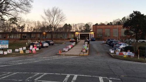 Students at DeKalb's International Community School, many of whom are immigrants and refugees, arrived today to a sea of signs of support from the surrounding Medlock neighborhood. A public charter school, ICS has more than 400 students representing more than 30 nationalities and speaking 25 languages. (ICS Facebook)