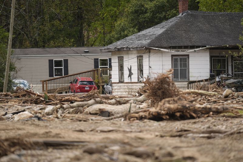 Homes lie in a debris field in the aftermath of Hurricane Helene, Thursday, Oct. 3, 2024, in Pensacola, N.C. (AP Photo/Mike Stewart)