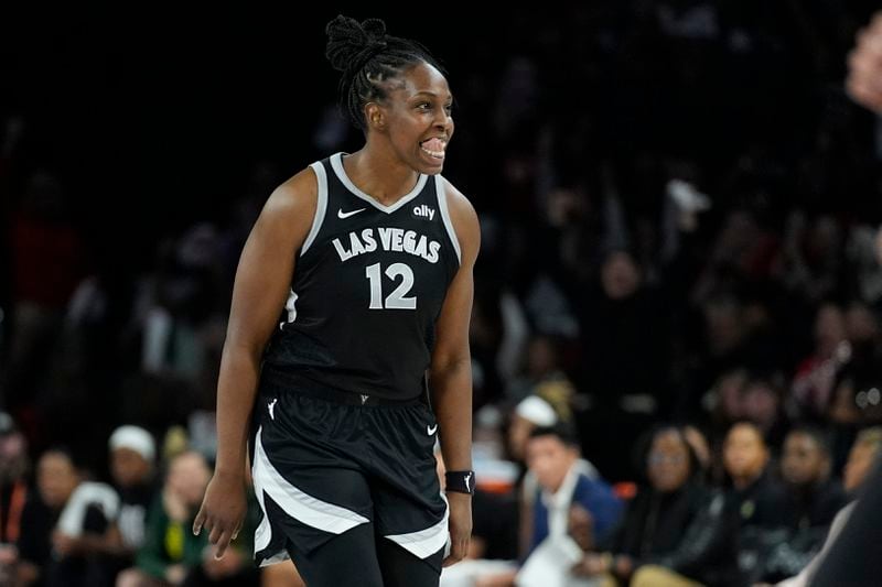 Las Vegas Aces guard Chelsea Gray (12) celebrates after making a 3-point shot against the Seattle Storm during the second half in Game 2 of a WNBA basketball first-round playoff game Tuesday, Sept. 24, 2024, in Las Vegas. (AP Photo/John Locher)