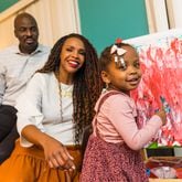 The McCown family is busy with their 2-year-old Priya McCowan, who turns three in early March and just added to her painting at their home.  Emanuel and Penelope McCowan struggled for years with fertility issues. Penelope now has a blog and a small business to help others in her situation.  (Jenni Girtman for The Atlanta Journal-Constitution)