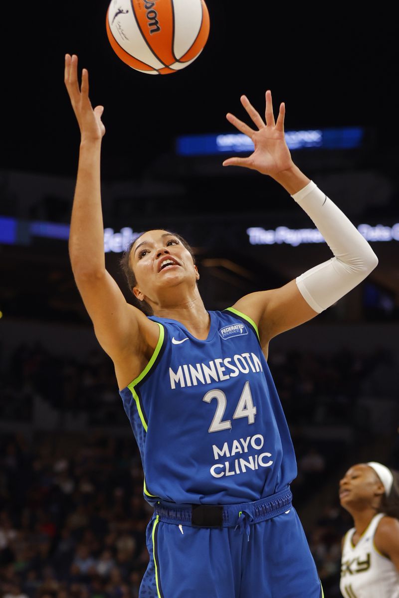 Minnesota Lynx forward Napheesa Collier gathers a rebound in the third quarter of a WNBA basketball game against the Chicago Sky, Friday, Sept. 13, 2024, in Minneapolis. (AP Photo/Bruce Kluckhohn)