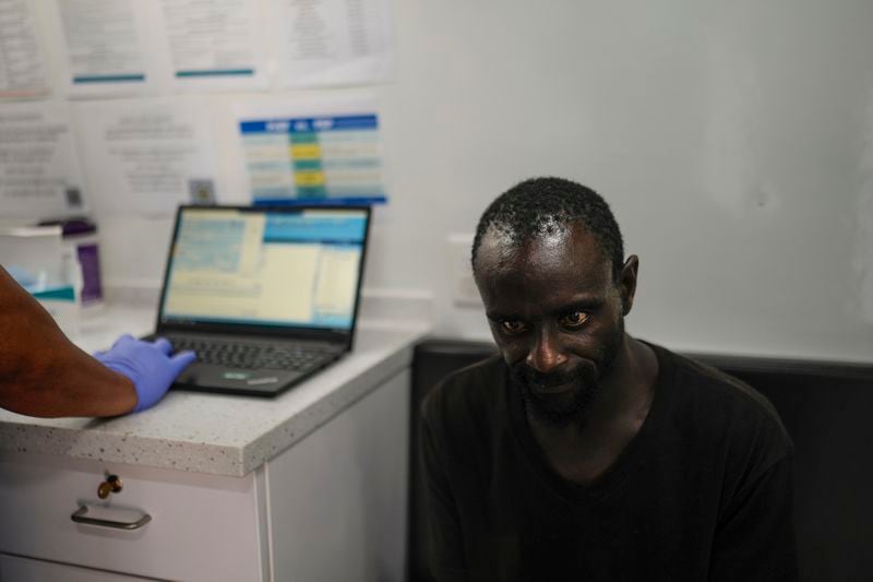 Donald Leverett visits Wesley Health Centers' mobile clinic for his medical services in the Skid Row area of Los Angeles, Tuesday, Aug. 27, 2024. (AP Photo/Jae C. Hong)