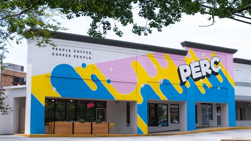 The exterior of Perc Coffee in Chastain Park features a bright pink, yellow and blue mural. / Courtesy of Perc Coffee