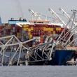 FILE - The cargo ship Dali is stuck under part of the structure of the Francis Scott Key Bridge after the ship hit the bridge, Tuesday, March 26, 2024, as seen from Pasadena, Md. (AP Photo/Mark Schiefelbein, File)