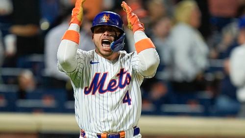 New York Mets' Francisco Alvarez reacts after hitting a walk off home run during the ninth inning of a baseball game against the Baltimore Orioles at Citi Field, Monday, Aug. 19, 2024, in New York. The Mets defeated the Orioles 4-3. (AP Photo/Seth Wenig)