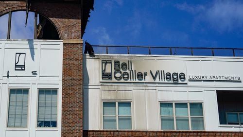 A blaze at the Bell Collier Village apartments happened during a party on the rooftop, and officials said it might have been caused by a propane grill filled with charcoal. A lawsuit was filed Sunday against the property owners and management.