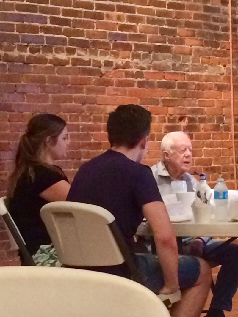 Former Carter Center intern Brenda Dutton having lunch and buttermilk with President Carter in 2017.