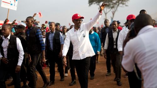 FILE - Rwanda's President Paul Kagame wave as he leaves an election campaign rally on the hills overlooking Kigali, Rwanda, on Aug. 2, 2017. Rwandans are voting Monday in an election that will almost certainly extend the long rule of Kagame, who is running virtually unopposed after three decades in power in the eastern African nation. (AP Photo/Jerome Delay, File)