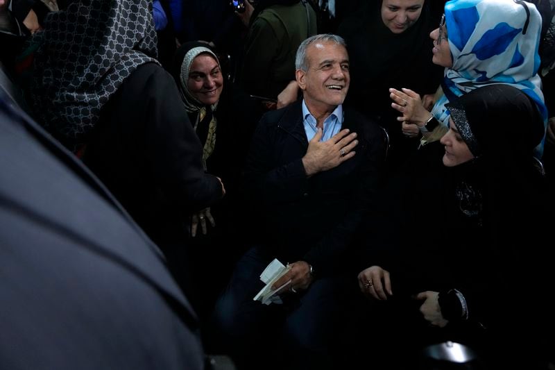 Reformist candidate for Iran's June 28, presidential election Masoud Pezeshkian greets his supporters, during a campaign rally in Tehran, Iran, Friday, June 14, 2024. (AP Photo/Vahid Salemi)