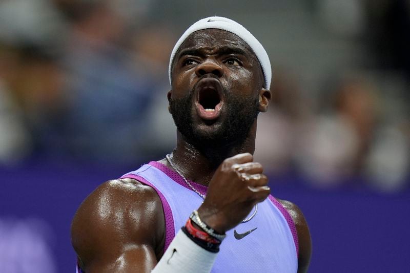 Frances Tiafoe, of the United States, reacts after breaking the serve of Taylor Fritz, of the United States, during the men's singles semifinals of the U.S. Open tennis championships, Friday, Sept. 6, 2024, in New York. (AP Photo/Seth Wenig)