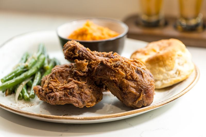 CONCOURSE D (D5) -- Chicken + Beer: Jay-Z isn't the only rapper in the airport restaurant and bar game -- Ludacris recently opened his Chicken + Beer concept, which serves up dishes including chicken and waffles, battered catfish, sandwiches and salads.