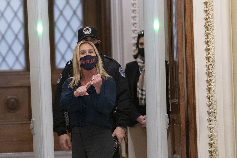 U.S. Rep. Marjorie Taylor Greene, R-Ga., yells at journalists as she passes through a newly installed metal detector outside the House Chamber in Washington, D.C. (Chris Kleponis/Sipa USA/TNS)