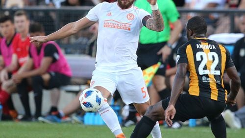 Atlanta United defender Leandro Gonzalez Pirez takes it away from Charleston Battery during the first half in a U.S. Open Cup match on Wednesday, June 6, 2018, in Kennesaw.  Curtis Compton/ccompton@ajc.com