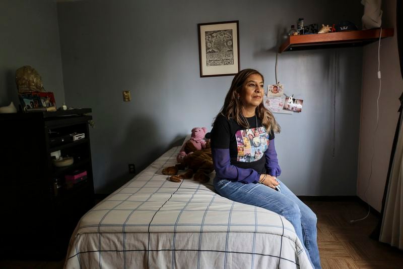 Veronica Rosas poses for a portrait in the bedroom of her missing son Diego Maximiliano in Ecatepec, Mexico, Friday, Aug. 2, 2024. Rosas' son went missing when he was 16 years old on Sept. 4, 2015. (AP Photo/Ginnette Riquelme)