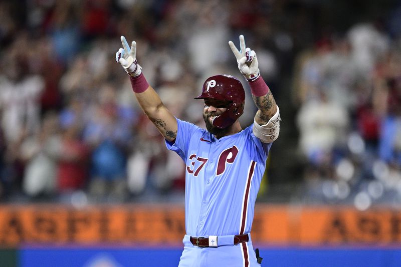 Philadelphia Phillies' Weston Wilson reacts after hitting a double off Washington Nationals' Orlando Ribalta during the eighth inning of a baseball game, Thursday, Aug. 15, 2024, in Philadelphia. (AP Photo/Derik Hamilton)