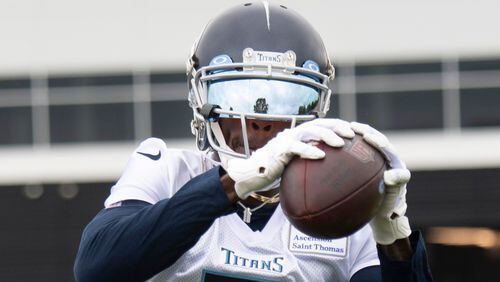 Wide receiver Julio Jones - who was traded from the Atlanta Falcons to the Tennessee Titans prior to the 2021 season - pulls in a pass during practice Thursday, June 10, 2021, in Nashville, Tenn. (George Walker IV/AP)