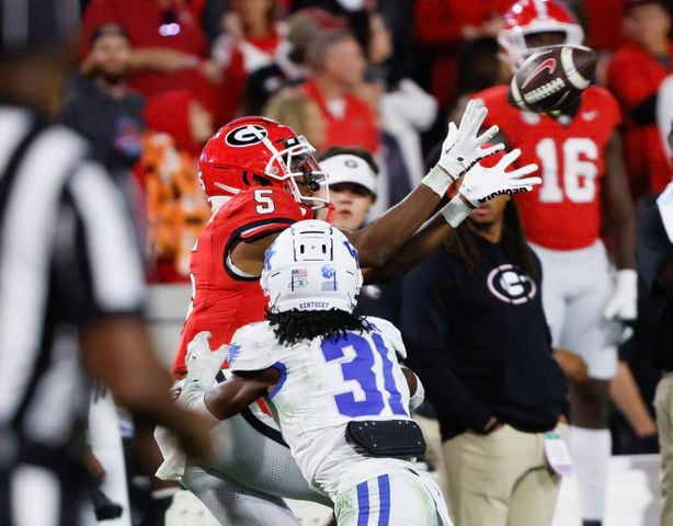  Georgia Bulldogs wide receiver Rara Thomas (5) makes a first down on this catch defended by Kentucky Wildcats defensive back Maxwell Hairston (31).  (Bob Andres for the Atlanta Journal Constitution)
