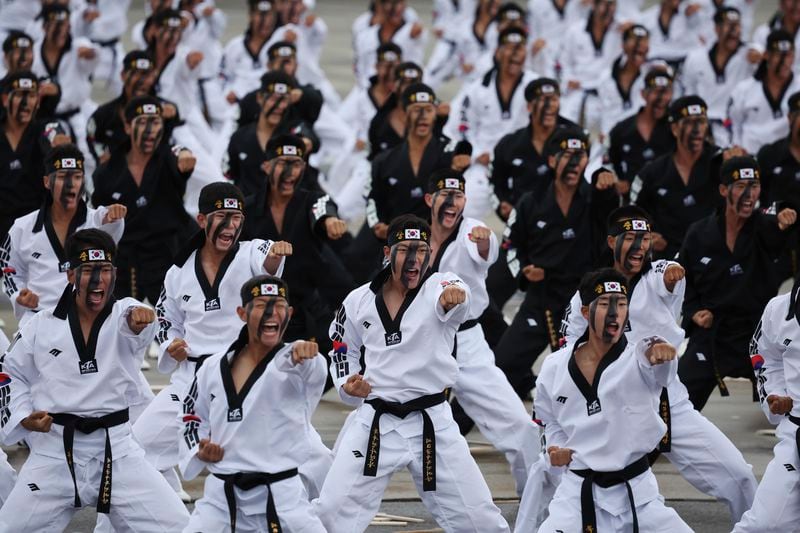 Members of the Special Warfare Command give a demonstration of their skills in the traditional Korean martial art of taekwondo during a celebration to mark 76th anniversary of Korea Armed Forces Day, in Seongnam, South Korea, Tuesday, Oct.1, 2024. (Kim Hong-Ji/Pool Photo via AP)