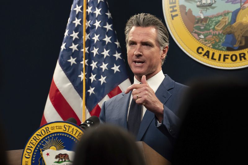 FILE - California Gov. Gavin Newsom answers a reporters question about his revised 2024-25 state budget during a news conference in Sacramento, Calif., Friday, May 10, 2024. On Saturday, June 22, Newsom and legislative leaders announced an agreement to close an estimated $46.8 billion budget deficit. (AP Photo/Rich Pedroncelli, File)