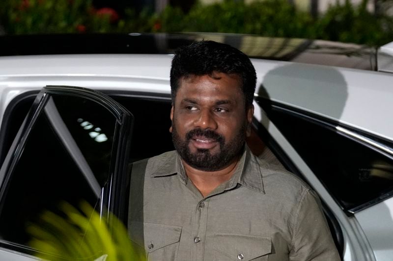 Marxist lawmaker Anura Kumara Dissanayake arrives at the election commission office after winning Sri Lankan presidential election, in Colombo, Sri Lanka, Sunday, Sept. 22, 2024. (AP Photo/Eranga Jayawardane)