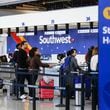 Travelers flying with Southwest Airlines wait in line at Hartsfield-Jackson International Airport in Atlanta on Friday, December 30, 2022. (Natrice Miller/natrice.miller@ajc.com)  