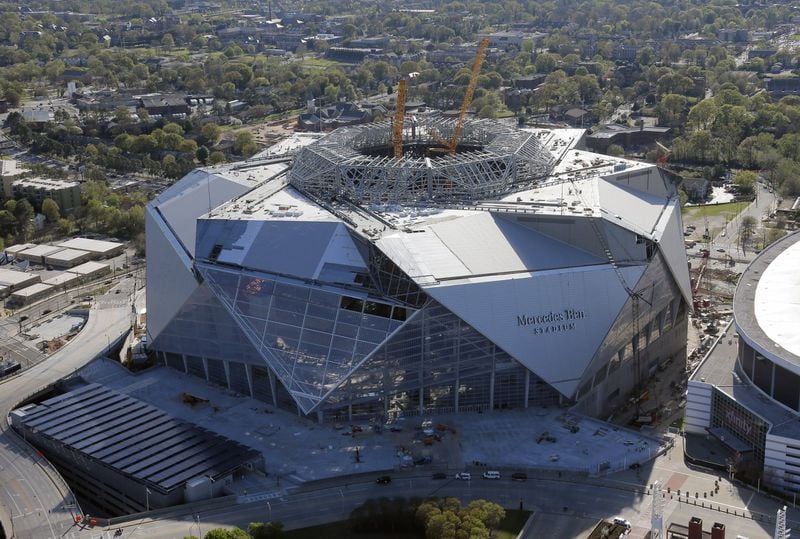 Mercedes Benz Stadium, home of the Atlanta Falcons, sits next to the Georgia Dome. Aerial photos shot March 31, 2017. BOB ANDRES /BANDRES@AJC.COM