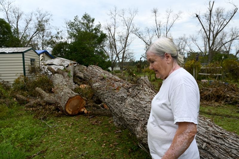 Linda Hall shows damages caused by Hurricane Helene at her daughter’s home, Tuesday, October 1, 2024, in Alapaha. Recovery efforts continue Sunday across Georgia’s 159 counties after Helene barreled through the state, causing catastrophic damage, flooding and at least 25 deaths. More than 400,000 people were still without power statewide after Helene entered South Georgia as a Category 2 hurricane around 1 a.m. Friday. Homes were destroyed, and neighborhoods were flooded across the state. (Hyosub Shin / AJC)