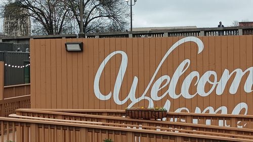 Georgia's state capitol dome is visible from porches at The Melody, a 40-unit development of housing for the homeless made from old shipping containers.