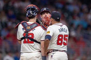 Braves catcher Sean Murphy (12), pitcher Aaron Bummer (center) and  bullpen coach Erick Abreu (85) confer on the mound during the eighth inning against the Rockies at Truist Park in Atlanta on Thursday, Sept. 5, 2024. (Arvin Temkar / AJC)