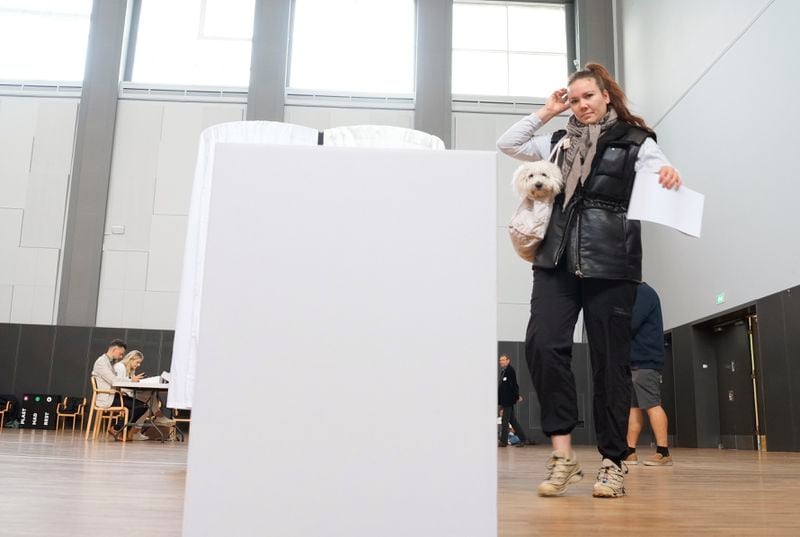 A woman prepares to cast her ballot for the European Parliament election, at the Aalborg Congress and Culture Center, in Aalborg, Denmark, Sunday, June 9, 2024. Polling stations have opened across Europe as voters from 20 countries cast ballots in elections that are expected to shift the European Union’s parliament to the right and could reshape the future direction of the world’s biggest trading bloc. (Henning Bagger /Ritzau Scanpix via AP)