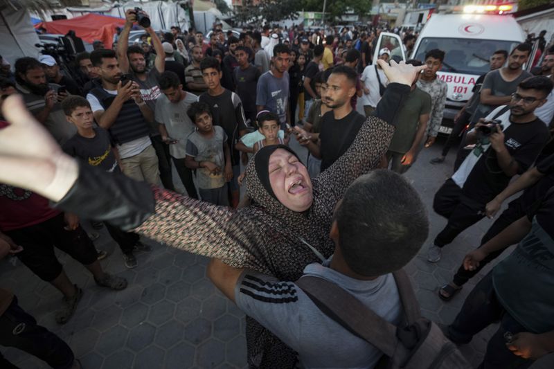Palestinian woman mourns relatives killed in the Israeli bombardment of the Gaza Strip outside a hospital in Deir al Balah on Tuesday, June 4, 2024. (AP Photo/Abdel Kareem Hana)