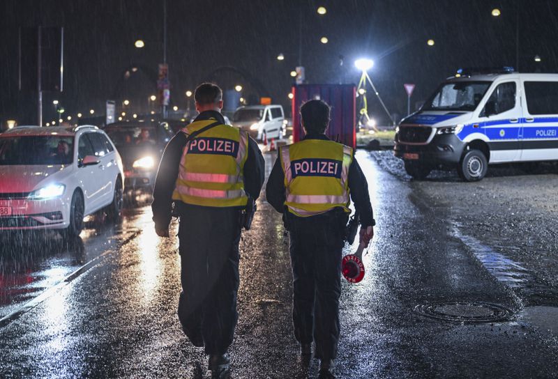 Two German Federal Police officers patrol at the border crossing to Poland in Frankfurt/Oder, Germany, Monday, Sept. 16, 2024. (Patrick Pleul/dpa via AP)