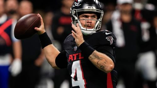 Atlanta Falcons quarterback Taylor Heinicke (4) works in the pocket against the Jacksonville Jaguars in the first half of an NFL preseason footballl game, Friday, Aug. 23, 2024, in Atlanta. (AP Photo/Butch Dill)