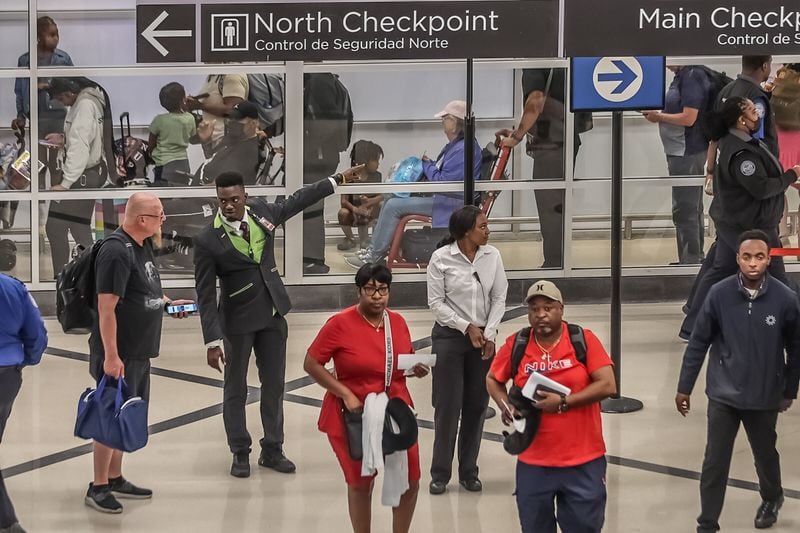 Passengers walk through Hartsfield-Jackson International Airport on Friday, May 24, 2024. Hartsfield-Jackson had a record number of passengers at security checkpoints as Memorial Day travel ramps up. (John Spink/AJC)