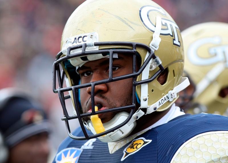 Georgia Tech offensive guard Omoregie Uzzi watches from the sideline during the Sun Bowl NCAA college football game against Southern California, Monday, Dec. 31, 2012, in El Paso, Texas.