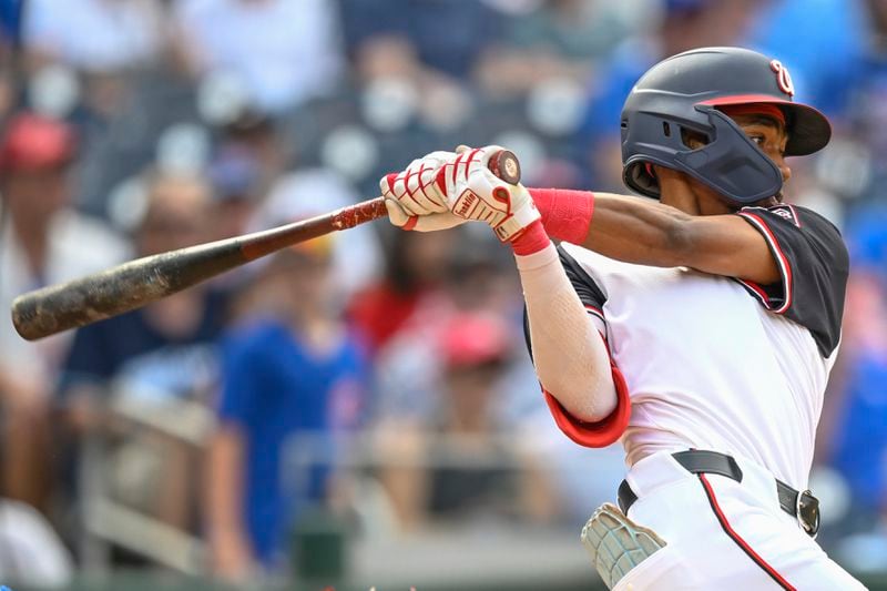 Washington Nationals' Darren Baker get his first major league hit during the ninth inning of a baseball game against the Chicago Cubs, Sunday, Sept. 1, 2024, in Washington. (AP Photo/John McDonnell)