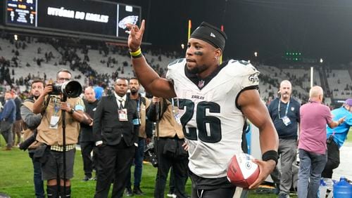 Philadelphia Eagles running back Saquon Barkley (26) leaves to field after their win against the Green Bay Packers in an NFL football game, Saturday, Sept. 7, 2024, at the Neo Quimica Arena in Sao Paulo. (AP Photo/Andre Penner)