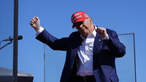 Republican presidential nominee former President Donald Trump dances after speaking at a campaign rally at Wilmington International Airport, Saturday, Sept. 21, 2024, in Wilmington, N.C. (AP Photo/Alex Brandon)