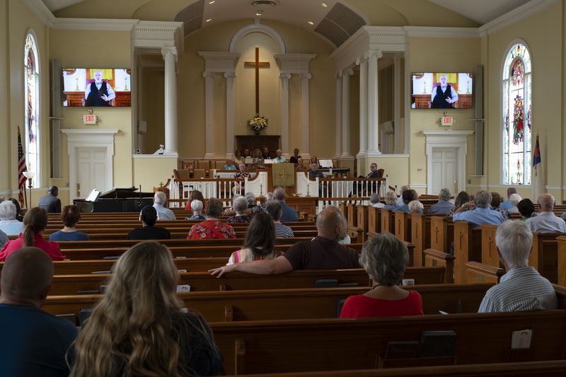 The Rev. Dr. Geoff Murphy, senior pastor at Winder First United Methodist Church, who was out of town, delivers a video message to his congregation about the Apalachee High School shootings during service Sunday, Sept. 8, 2024. Ben Gray for the Atlanta Journal-Constitution