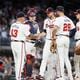 Braves pitcher Charlie Morton (50)  is removed from the game by manager Brian Snitker (43) during the seventh inning of Monday's game against the Reds at Truist Park. (Miguel Martinez/ AJC)