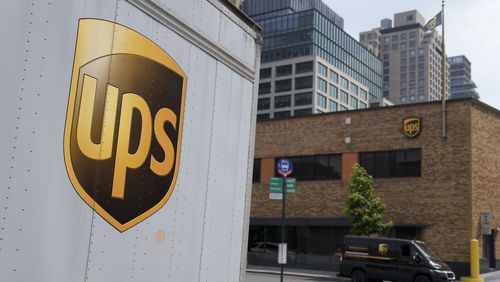 FILE - A delivery vehicle passes by a UPS depot, June 29, 2023, in New York. (AP Photo/John Minchillo, File)