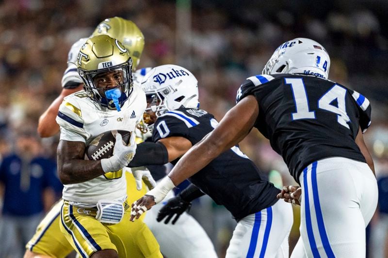 Georgia Tech Yellow Jackets wide receiver Malik Rutherford (8) breaks a tackle in the first quarter of a football game against the Duke BlueDevils, Saturday, Oct. 5, 2024, in Atlanta. (AP Photo/Jason Allen)