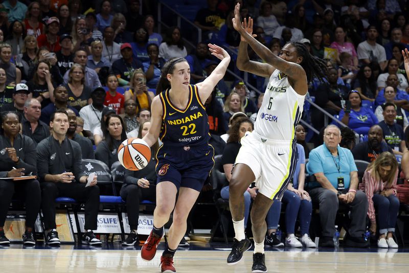 Indiana Fever guard Caitlin Clark (22) drives past Dallas Wings forward Natasha Howard (6) during the first half of an WNBA basketball game in Arlington, Texas, Friday, May 3, 2024. (AP Photo/Michael Ainsworth)