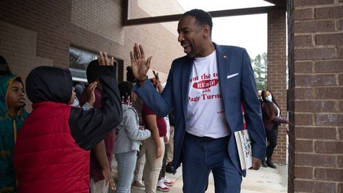 Atlanta Mayor Andre Dickens is greeted by students at Heritage Academy elementary school in Atlanta on Feb. 2, 2023 (Riley Bunch/riley.bunch@ajc.com)