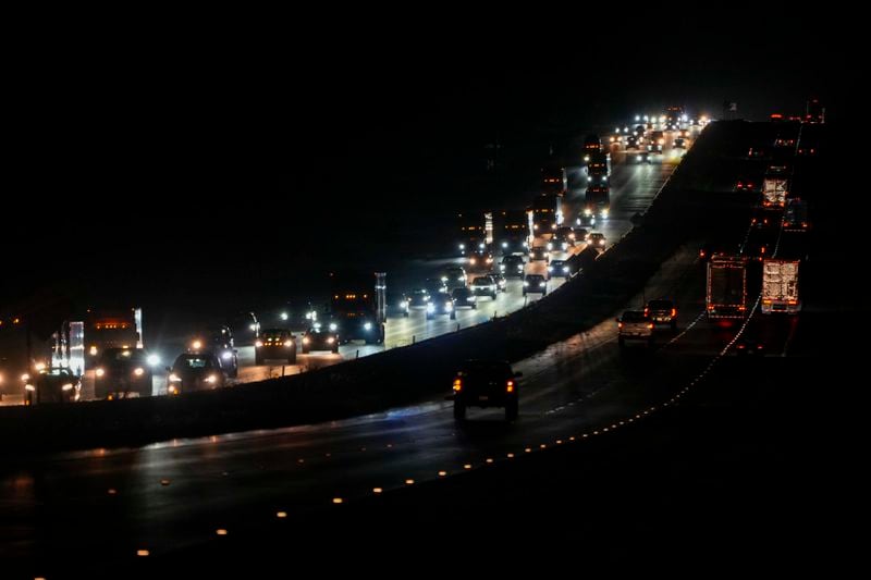 Heavy traffic flows northbound on Interstate-75 as people evacuate the Tampa Bay area ahead of Hurricane Milton's arrival late Monday, Oct. 7, 2024, in Ocala, Fla. (AP Photo/Julio Cortez)